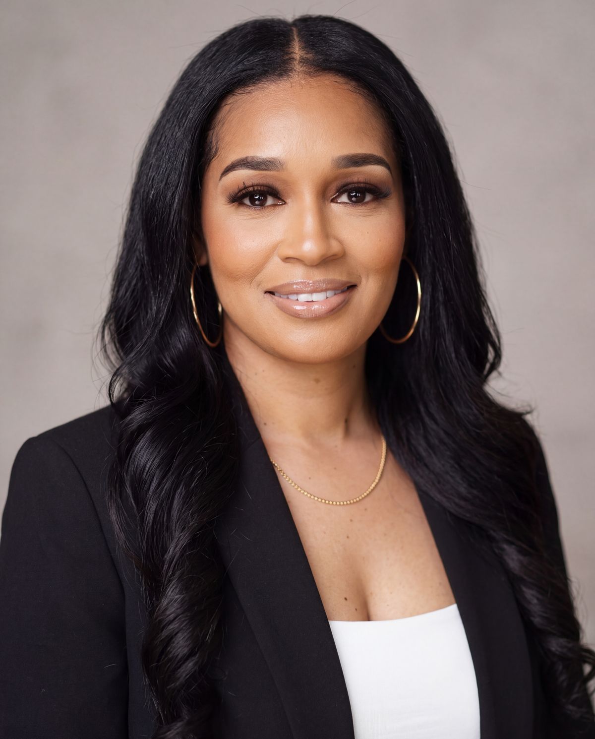 Stephanie Johnson in a black blazer, studio portrait